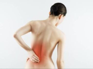 Back pain in the lumbar region of a woman. 