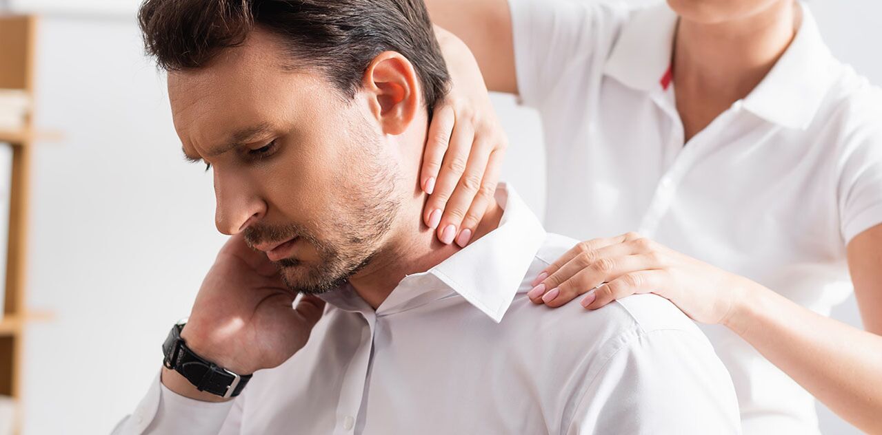 Patient with neck pain during diagnostic examination